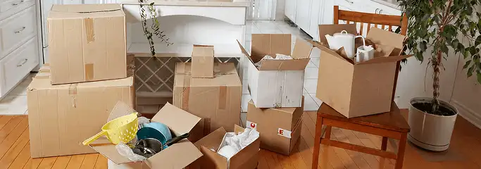 Packed moving boxes and household items in a kitchen before move-out or move-in cleaning, Columbus, OH.
